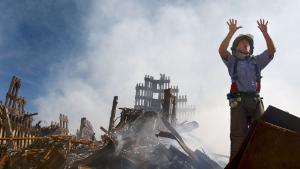 394558 06: A New York City fireman calls for 10 more rescue workers to make their way into the rubble of the World Trade Center September 14, 2001 days after the September 11, 2001 terrorist attack. (U.S. Navy Photo by Preston Keres/Getty Images)