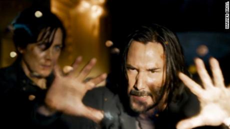 Keanu Reeves as Neo (right) and Carrie-Ann Moss as Trinity (left) are back in 