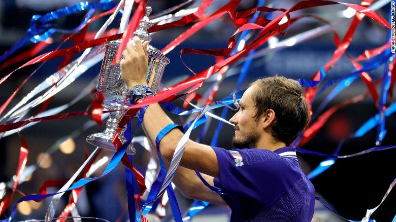 Daniil Medvedev of Russia celebrates with the championship trophy after defeating Novak Djokovic to win the Men's Singles final match on Day Fourteen of the 2021 US Open.