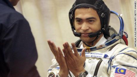 Sheikh Muszaphar Shukor, Malaysia&#39;s first astronaut, shown taking part in a farewell ceremony at the Baikonur cosmodrome, in Kazakhstan, on October 10, 2007 before lifting off for the International Space Station with Russian cosmonaut Yury Malenchenko and American Peggy Whitson. 
