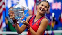 Emma Raducanu, of Britain, holds up the US Open championship trophy after defeating Leylah Fernandez, of Canada, during the women&#39;s singles final of the US Open tennis championships, Saturday, Sept. 11, 2021, in New York. (AP Photo/Seth Wenig)