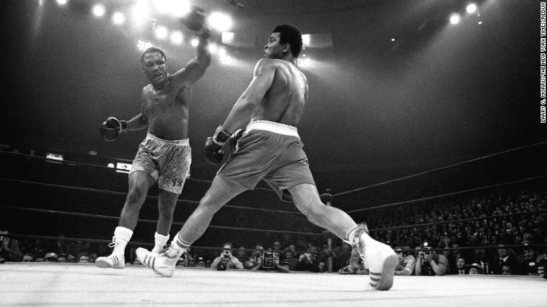 Muhammad Ali evades a punch from Joe Frazier during &quot;The Fight of the Century&quot; at Madison Square Garden in New York, March 8, 1971.