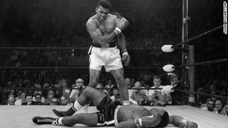 Muhammad Ali stands over Sonny Liston after dropping Liston with a hard short right on May 25, 1965. 