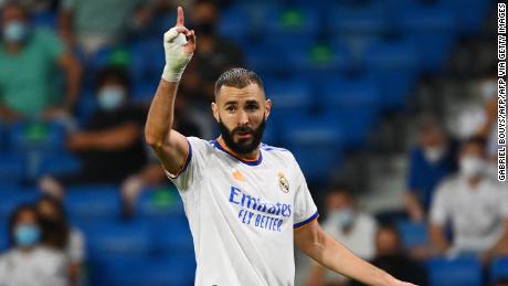 Real Madrid&#39;s French forward Karim Benzema gestures during the Spanish League football match between Real Madrid CF and RC Celta de Vigo at the Santiago Bernabeu stadium in Madrid on September 12, 2021.