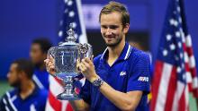 Medvedev celebrates with the US Open tophy -- his first major title. 