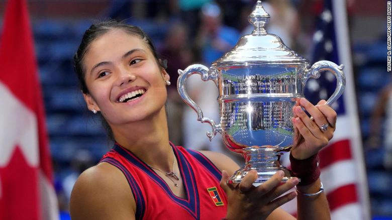 Britain&#39;s Emma Raducanu celebrates with the trophy after winning the 2021 US Open.