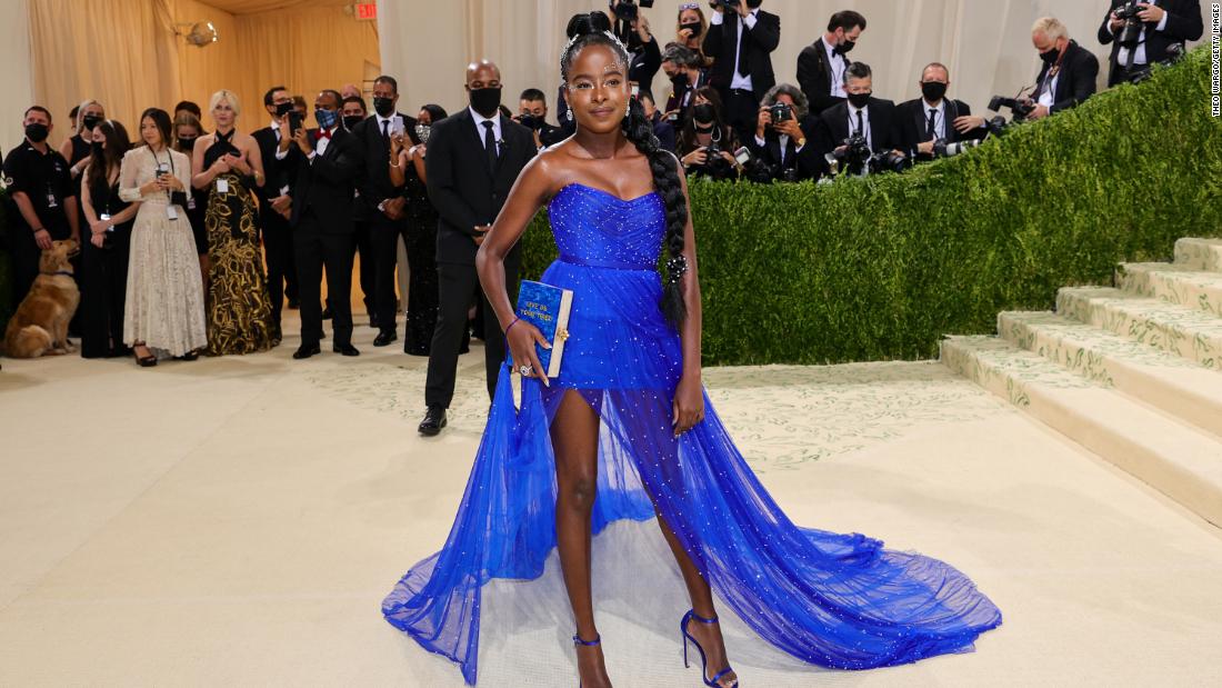 Met Gala co-chair Amanda Gorman wore a bespoke blue Vera Wang gown and a silver laurel crown. Representing a reimagined Statue of Liberty, she held an Edie Parker clutch that said &quot;Give Me Your Tired&quot; a reference to the poem at the statue&#39;s base.