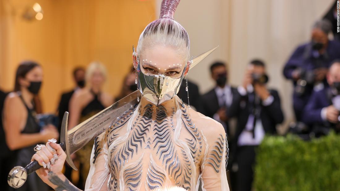 Grimes went full sci-fi and was inspired by &quot;Dune,&quot; she said during Vogue&#39;s livestreamed coverage of the event. The musician carried a sword made from melted-down guns -- the work of MSCHF, the art collective behind Lil Nas X&#39;s controversial &quot;Satan&quot; shoes.