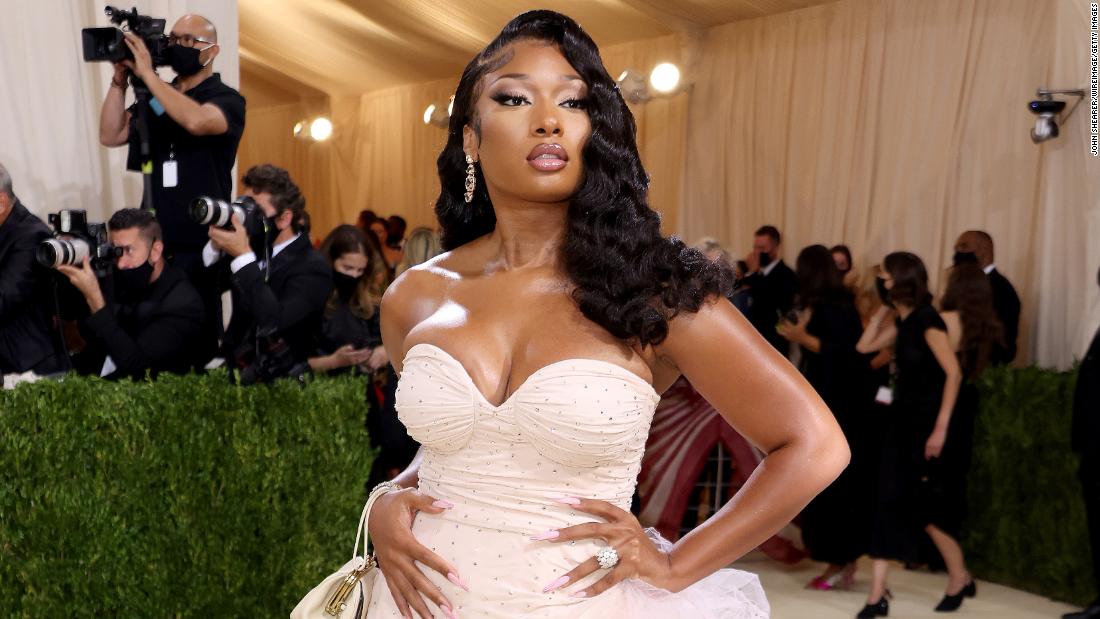 Megan Thee Stallion glittered in hand-embroidered crystals on an old-Hollywood-inspired pink Coach gown, which featured an asymmetrical hem.