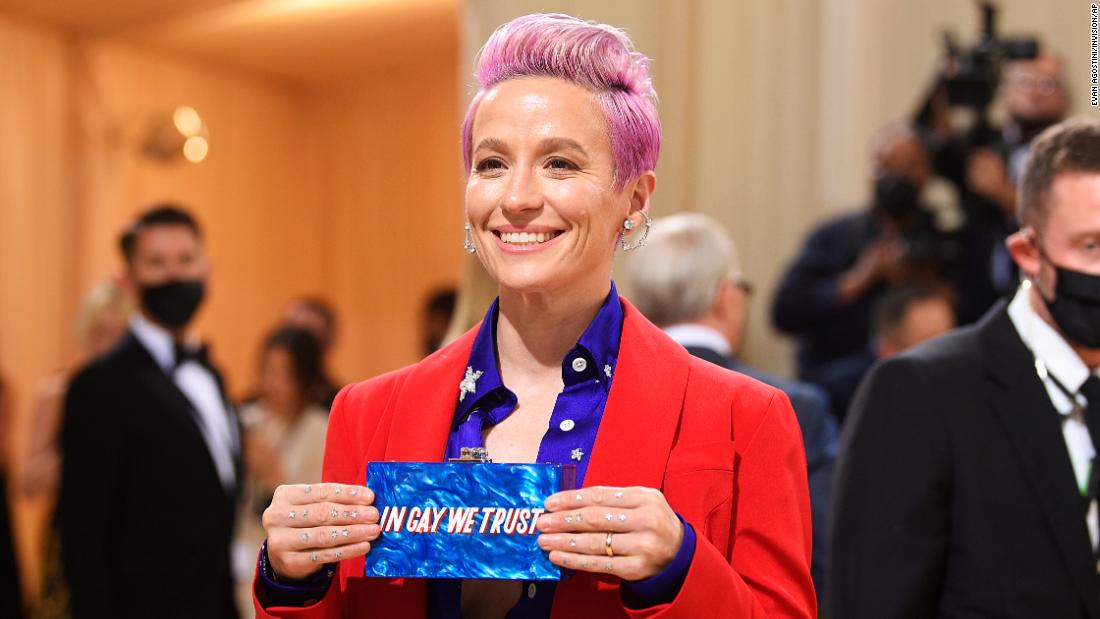 Soccer player Megan Rapinoe arrived in an outfit inspired by the colors of the American flag, wearing a red suit and blue and white starry shirt. She also carried a clutch which read &quot;In gay we trust,&quot; which she held up to photographers.