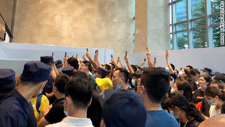 People gathering to demand repayment of loans and financial products at Evergrande&#39;s headquarters in Shenzhen on Monday. 