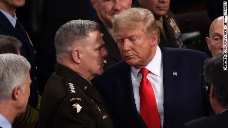 Chairman of the Joint Chiefs of Staff Gen. Mark Milley chats with US President Donald Trump after he delivered the State of the Union address at the US Capitol in Washington, DC, on February 4, 2020.