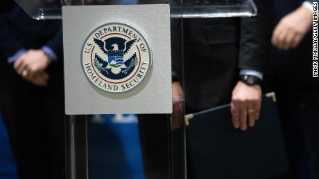 The U.S. Department of Homeland Security seal is seen as DHS Secretary Alejandro Mayorkas delivers remarks while visiting a FEMA community vaccination center on March 2, 2021 in Philadelphia, Pennsylvania. 