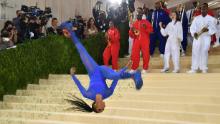 TOPSHOT - US gymnast Nia Dennis arrives for the 2021 Met Gala at the Metropolitan Museum of Art on September 13, 2021 in New York. - This year&#39;s Met Gala has a distinctively youthful imprint, hosted by singer Billie Eilish, actor Timothee Chalamet, poet Amanda Gorman and tennis star Naomi Osaka, none of them older than 25. The 2021 theme is &quot;In America: A Lexicon of Fashion.&quot; (Photo by ANGELA  WEISS / AFP) (Photo by ANGELA  WEISS/AFP via Getty Images)