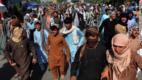 Local residents march against a reported announcement by the Taliban, asking them to evict their homes built on state-owned land in Kandahar on September 14.