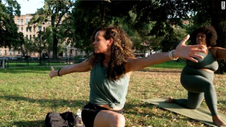 Students attend an outdoor BK Yoga Club class in Brooklyn&#39;s Herbert Von King Park on August 11, 2021.