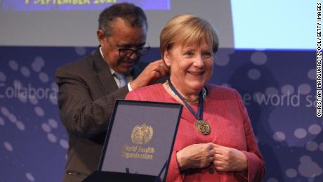 Angela Merkel receives a medal from Tedros Adhanom Ghebreyesus, Director-General of the World Health Organization (WHO), during the opening of the WHO Hub for Pandemic and Epidemic Intelligence at the Langenbeck-Virchow building on September 1, 2021 in Berlin, Germany. 