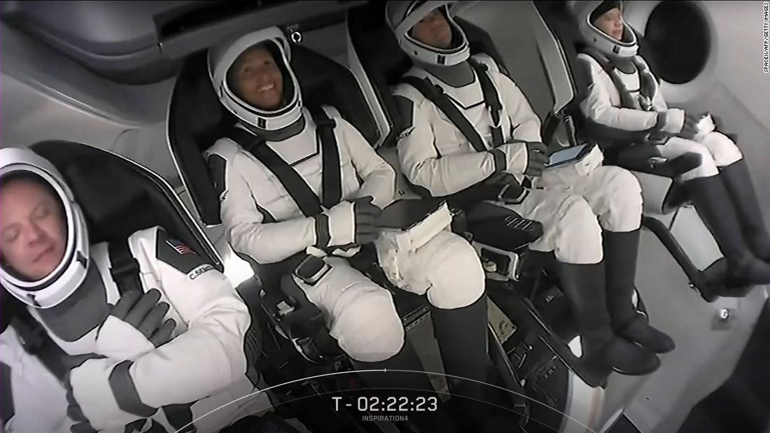 From left, Sembroski, Proctor, Isaacman and Arceneaux are buckled into the Crew Dragon capsule ahead of their launch.