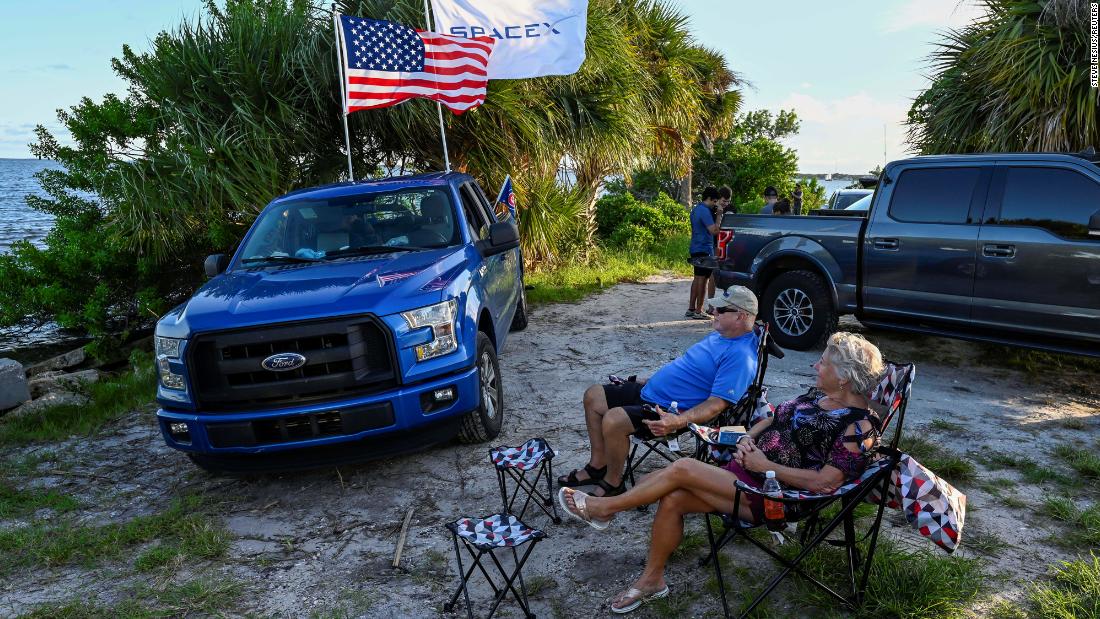 David and Nora Thurman wait to watch the launch along the Indian River Lagoon in Titusville, Florida. 