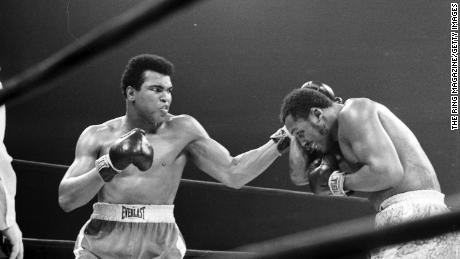 Ali lands a left hook on Joe Frazier during their fight at Madison Square Garden on March 8, 1971.