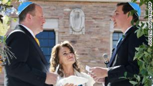 Colorado Gov. Jared Polis, left, and his partner, Marlon Reis, were married Wednesday in a Jewish ceremony, according to the governor&apos;s office. 