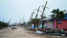 A motorist drives down a road in the wake of Hurricane Ida on September 4, 2021 in Grand Isle, Louisiana. 