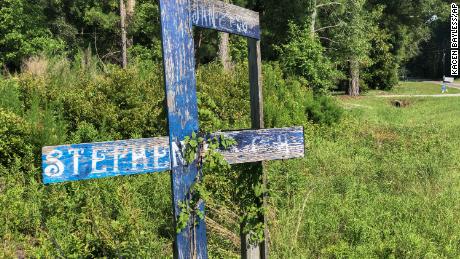 A wooden memorial erected for Stephen Nicholas Smith, 19, who was found dead on a country road in 2015. 