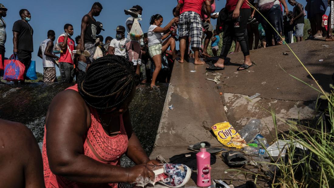 Migrants wade in the Rio Grande on September 16.