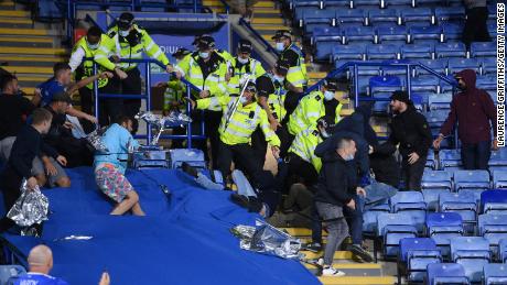 Fans from both side&#39;s clash as police intervene inside the King Power Stadium.