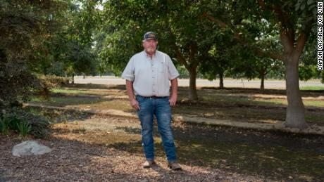 Doug Verboon, the Kings County District 3 Supervisor, is photographed among walnut trees at his property in California&#39;s Central Valley.