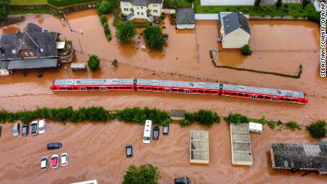 A regional train sits in the flood waters at the local station in Kordel, Germany, Thursday July 15, 2021, after it was flooded by the high waters of the Kyll River. 