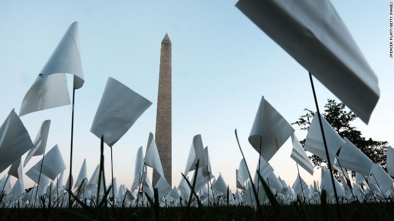The &quot;In America: Remember&quot; public art installation in Washington, DC, commemorates all Americans who have died from Covid-19. On September 18, more than 660,000 small plastic flags were at the site, some with personal messages to those who died.  