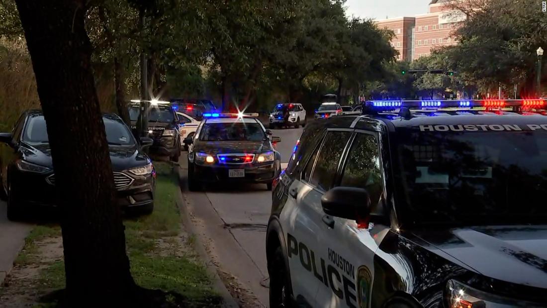 Houston police officer slain and another officer wounded while executing a warrant, mayor says. A possible suspect is dead