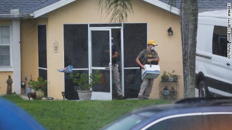 FBI agents take away possible evidence from the family home of Brian Laundrie in North Port, Florida, on September 21, 2021.