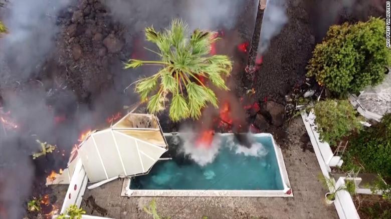  Lava swallows swimming pool and homes in Spain