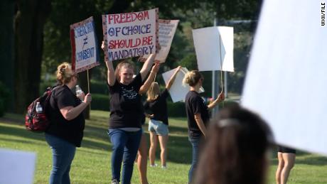 Dozens of health care workers protested Novant Health&#39;s vaccine mandate for employees outside of Forsyth Medical Center in Winston-Salem, North Carolina, on August 9.