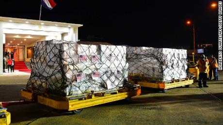 Boxes containing part of the one million doses of Pfizer's Covid-19 vaccine donated by the United States, are seen upon arrival at Silvio Pettirossi International Airport in Luque, Paraguay on July 9, 2021. 