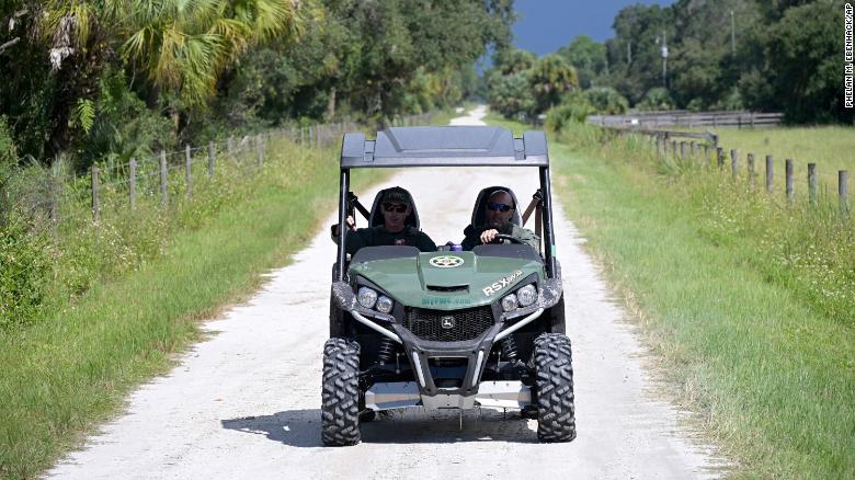 Florida Fish and Wildlife Commission officers ride up a private road near the entrance of the Carlton Reserve during a search for Brian Laundrie on Tuesday, September 21.