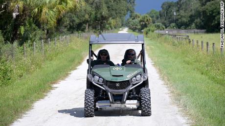 Florida Fish and Wildlife Commission agents use a private road near the entrance to the Carlton Preserve during a search for Brian Laundrie on September 21.