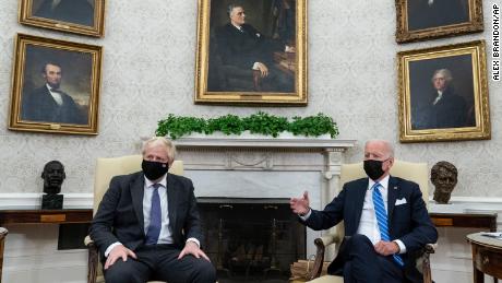President Joe Biden, right, speaks during a meeting with British Prime Minister Boris Johnson in the Oval Office of the White House, Tuesday, Sept. 21, 2021, in Washington, DC.