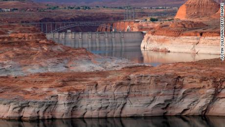 PAGE, ARIZONA - JUNE 24: A view of the Glen Canyon Dam at Lake Powell on June 24, 2021 in Page, Arizona. As severe drought grips parts of the Western United States, a below average flow of water is expected to flow through the Colorado River Basin into two of its biggest reservoirs, Lake Powell and Lake Mead. Lake Powell is currently at 34.56 percent of capacity, a historic low. The lake stands at 138.91 feet below full pool and has dropped 44 feet in the past year. The Colorado River Basin supplies water to 40 million people in seven western states. (Photo by Justin Sullivan/Getty Images)