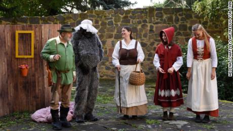 Characters perform &quot;Little Red Riding Hood&quot; at the monestary garden.