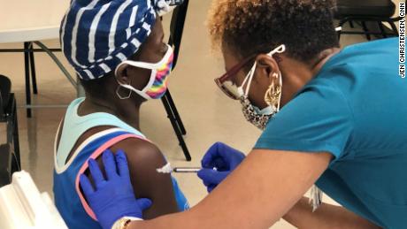 A woman gets her first Covid-19 vaccine at a Cuthbert, Georgia, clinic aimed at teens