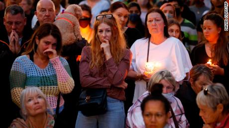 People gather during a vigil for Sabina Nessa in Kidbrooke in London.