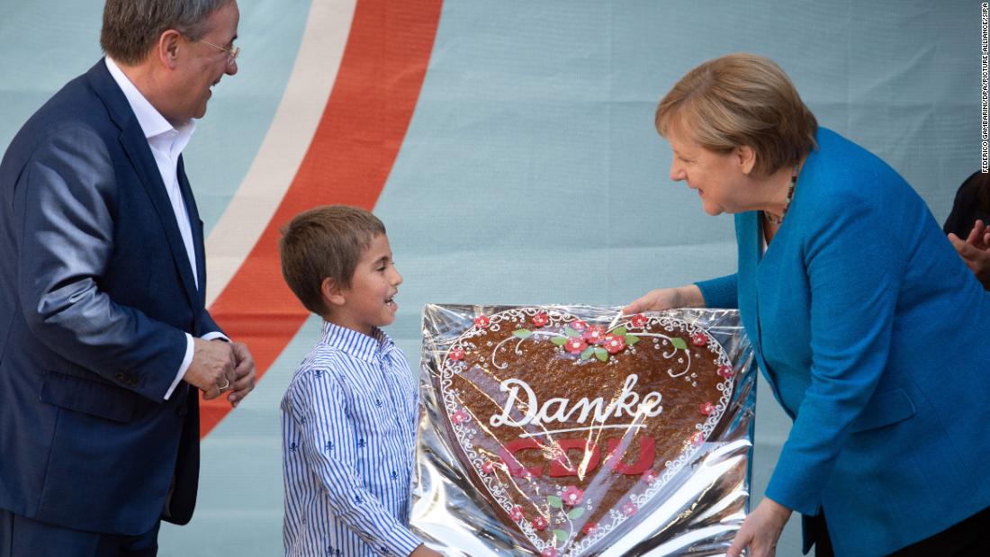 A child gives Merkel a gingerbread heart with the inscription &quot;Danke CDU,&quot; meaning &quot;Thank you, CDU,&quot; during a Christian Democratic Union campaign event in Aachen, Germany, in September 2021. At left is Armin Laschet, Merkel&#39;s successor at the helm of the CDU, a long-time ally of the Chancellor and the party&#39;s deputy leader since 2012. He was &lt;a href=&quot;https://www.cnn.com/2021/09/22/europe/germany-election-explainer-cmd-intl/index.html&quot; target=&quot;_blank&quot;&gt;one of the candidates who ran to replace her.&lt;/a&gt;