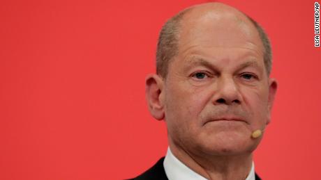 Olaf Scholz, top candidate for chancellor of the Social Democratic Party (SPD) addresses his supporters after German parliament election at the party&#39;s headquarters in Berlin, Sunday, Sept. 26, 2021. (AP Photo/Lisa Leutner)