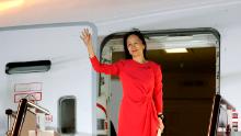 In this photo released by China&#39;s Xinhua News Agency, Huawei CFO Meng Wanzhou waves as she steps out of an airplane after arriving at Shenzhen Bao&#39;an International Airport in Shenzhen in southern China&#39;s Guangdong Province, Saturday, Sept. 25, 2021. A top executive from global communications giant Huawei Technologies returned to China on Saturday following what amounted to a high-stakes prisoner swap with Canada and the U.S. (Jin Liwang/Xinhua via AP)