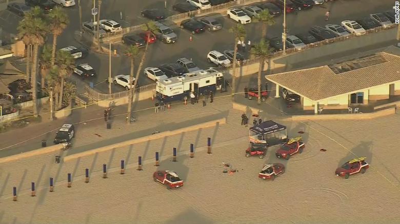 Police say they shot and killed an armed man near where crowds had gathered for the US Open of Surfing event
