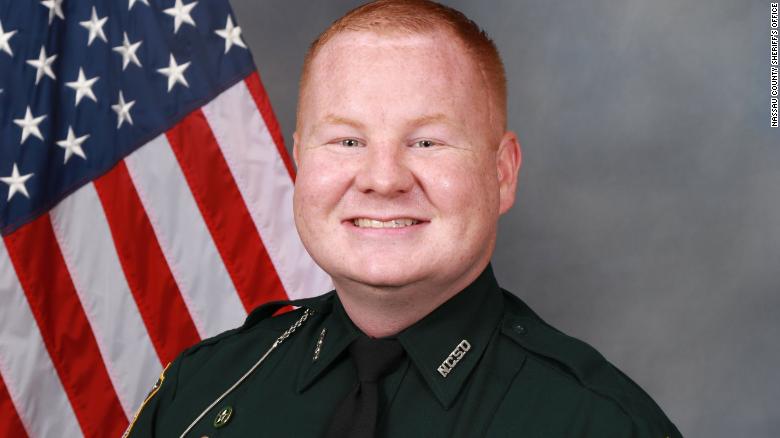 More than 300 people are involved in manhunt for a suspect after a Florida sheriff’s deputy was shot during a traffic stop