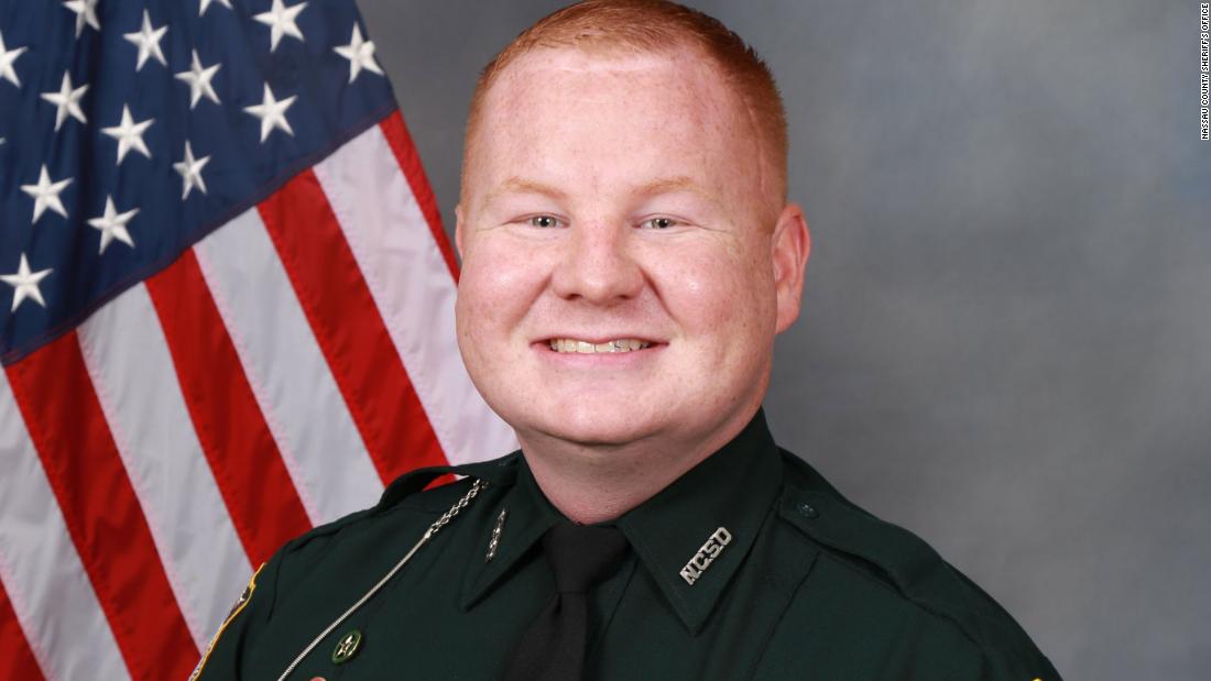 More than 300 people are involved in manhunt for a suspect after a Florida sheriff's deputy was shot during a traffic stop